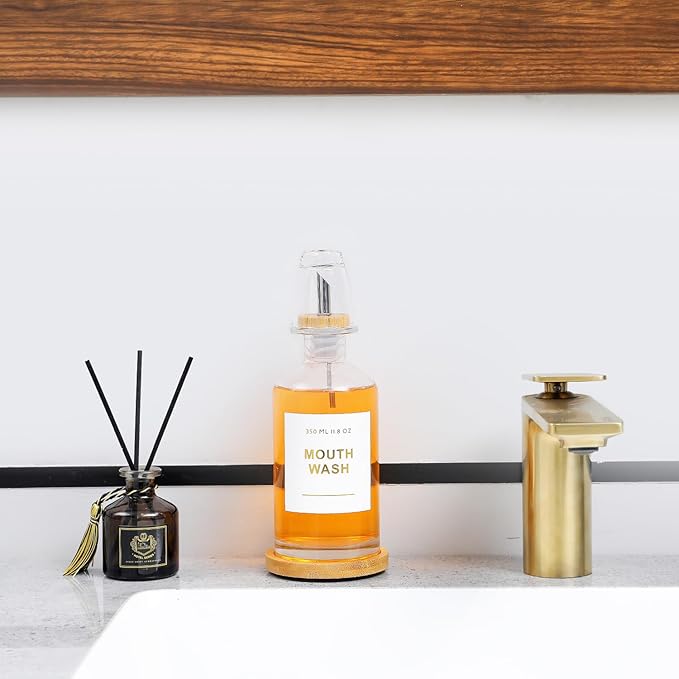 11.8OZ Glass Mouthwash Dispenser for Bathroom with Stainless Steel & Bamboo Nozzle, Mouthwash Cup Reusable, Bamboo Tray, and Elegant Gold Sticker.（Clear
